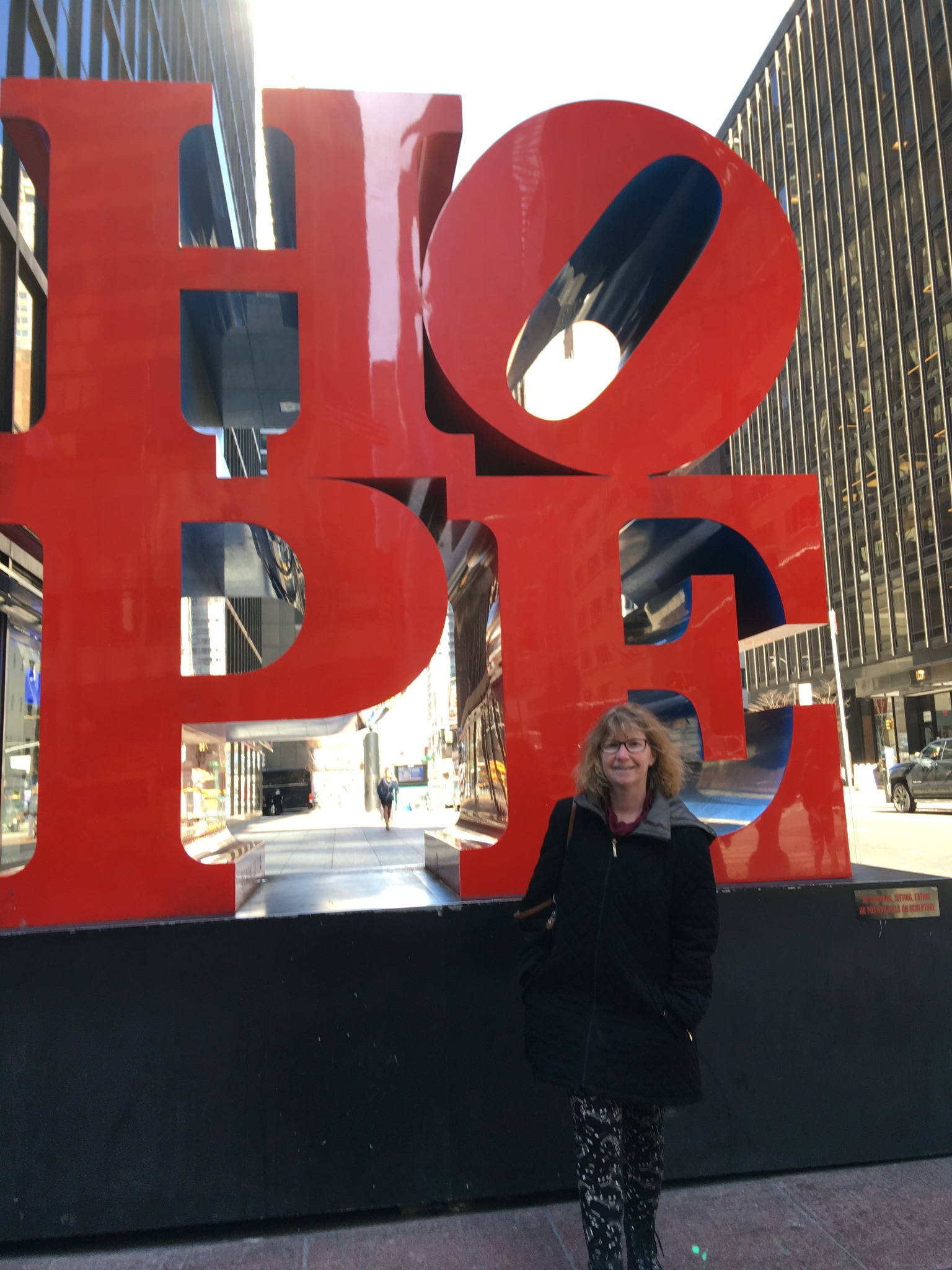 Nicole standing beside the LOVE sculpture