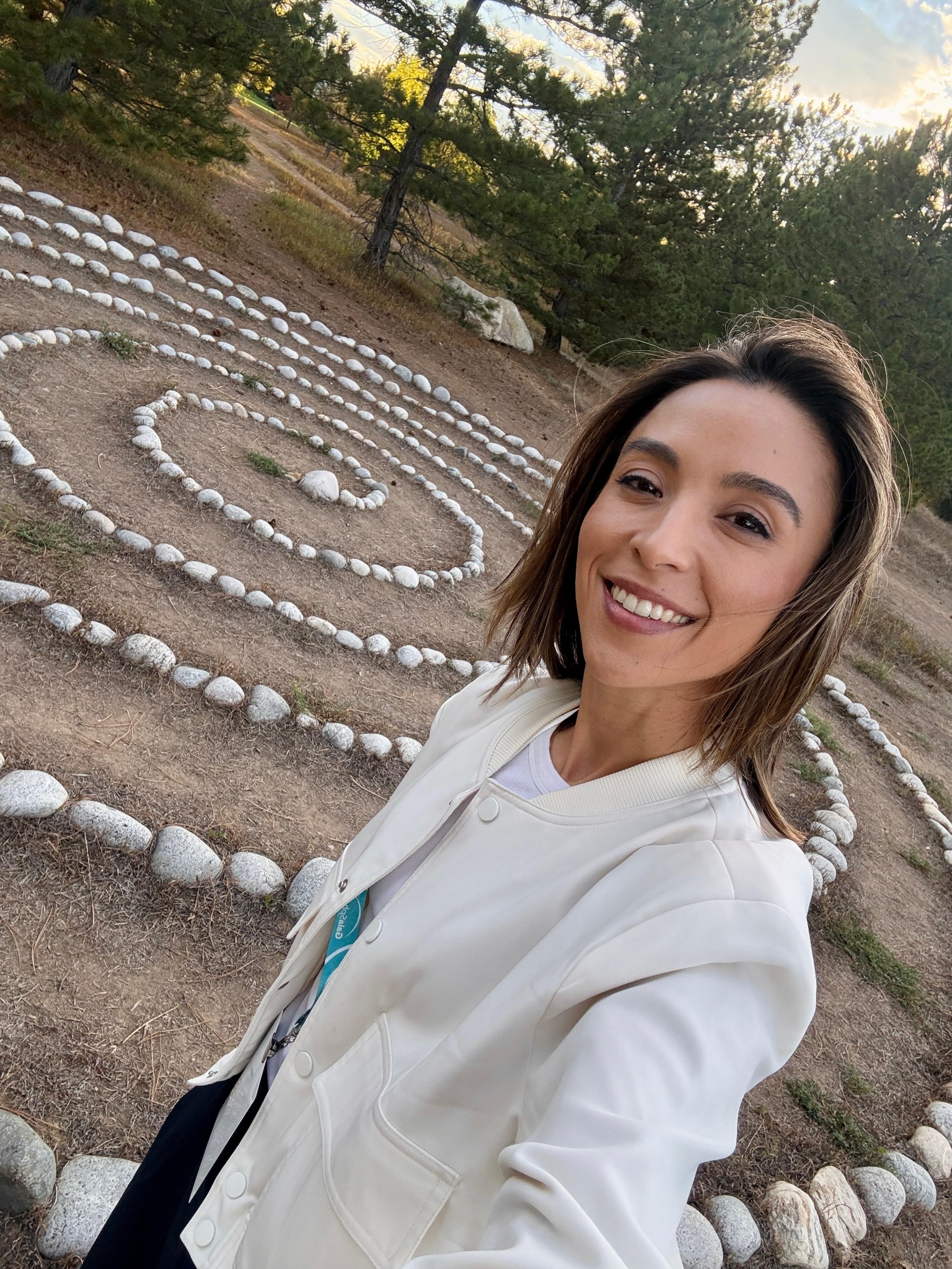 Melanie beside a winding stone path